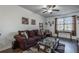 Cozy living room with comfortable seating, large window, and a glass coffee table on a patterned rug at 15 Corinth Rd, Cartersville, GA 30121