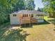 A long view of the back exterior and back deck of the home at 1875 Creekside Ct, Decatur, GA 30032