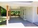 A spacious back porch with brown wood railing, painted white brick, neutral colors at 1875 Creekside Ct, Decatur, GA 30032