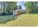 A wide shot of the backyard, including the exterior of the home at 1875 Creekside Ct, Decatur, GA 30032