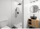 Well-lit bathroom showcases a black vessel sink, wood vanity, walk-in shower, and a modern toilet at 1875 Creekside Ct, Decatur, GA 30032