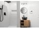 Modern bathroom featuring a black vessel sink, wood vanity, and subway tile shower with matte black fixtures at 1875 Creekside Ct, Decatur, GA 30032