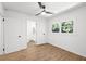 Bedroom featuring wood-look flooring and an open bathroom at 1875 Creekside Ct, Decatur, GA 30032