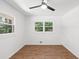 Bedroom featuring wood-look flooring and two windows at 1875 Creekside Ct, Decatur, GA 30032