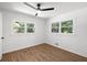 Bedroom featuring wood-look flooring and two windows at 1875 Creekside Ct, Decatur, GA 30032