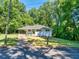 Beautifully renovated single-story home with new landscaping and white brick at 1875 Creekside Ct, Decatur, GA 30032