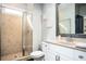 Bright bathroom with a tiled shower, a white vanity, and modern fixtures at 2541 Kickerillo Se Way, Atlanta, GA 30316