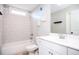 Well-lit bathroom featuring a shower-tub combination with white tile and a modern vanity at 2541 Kickerillo Se Way, Atlanta, GA 30316