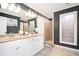 Elegant bathroom featuring double vanity, granite countertops, and a bright window at 2541 Kickerillo Se Way, Atlanta, GA 30316