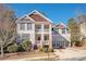 Charming two-story home with a welcoming front porch and well-manicured landscaping at 2541 Kickerillo Se Way, Atlanta, GA 30316