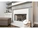 Close up of the living room fireplace with white brick and grey trim at 2541 Kickerillo Se Way, Atlanta, GA 30316