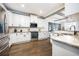 Spacious kitchen with granite countertops, stainless steel appliances, and wooden floors at 2541 Kickerillo Se Way, Atlanta, GA 30316