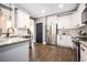 Modern kitchen with stainless steel appliances, white cabinets, and hardwood flooring at 2541 Kickerillo Se Way, Atlanta, GA 30316