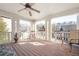 Inviting porch with wooden floors, white pillars, ceiling fan and views of the surrounding neighborhood at 2541 Kickerillo Se Way, Atlanta, GA 30316