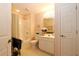 Well-lit bathroom featuring a tub and shower combination and a white single sink vanity at 3787 Vineyards Lake Nw Cir # 21, Kennesaw, GA 30144