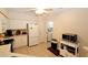 White kitchen with appliances, a view of laundry room, and ceiling fan at 3787 Vineyards Lake Nw Cir # 21, Kennesaw, GA 30144