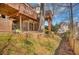View of the home's tiered deck overlooking the backyard with a lawnmower and swing at 4753 Outlook Ne Way, Marietta, GA 30066