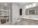 Bright bathroom featuring white vanities, a glass shower, and stylish decor at 4753 Outlook Ne Way, Marietta, GA 30066