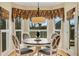 Breakfast nook featuring a table, chairs, and bay window with decorative valances at 4753 Outlook Ne Way, Marietta, GA 30066