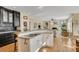 Bright kitchen features hardwood floors, granite countertops, and black and white cabinetry at 4753 Outlook Ne Way, Marietta, GA 30066