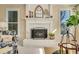 Cozy living room with a white brick fireplace, mantel, and natural light, creating a warm atmosphere at 4753 Outlook Ne Way, Marietta, GA 30066