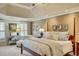 Spacious main bedroom featuring a tray ceiling, seating area and natural light at 4753 Outlook Ne Way, Marietta, GA 30066