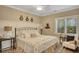 Comfortable bedroom with a decorative headboard, luxury bedding and plantation shutters at 4753 Outlook Ne Way, Marietta, GA 30066