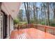 Wooden deck overlooking a backyard surrounded by mature trees providing ample privacy at 6510 Connell Rd, Atlanta, GA 30349