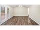 Cozy dining room featuring wood floors, modern light fixture, and access to a deck at 6510 Connell Rd, Atlanta, GA 30349