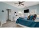 Comfortable bedroom with blue accents, shutters, and a view to the ensuite bathroom at 1835 Leighton Ne Ln, Marietta, GA 30062