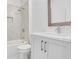 Modern bathroom featuring a shower over tub, marbled tiles and a sleek vanity with modern fixtures at 2239 Chestnut Pass, Decatur, GA 30033