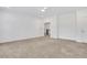 Bright bedroom with neutral carpet, ceiling fan, and a door to the upper floor at 2239 Chestnut Pass, Decatur, GA 30033