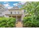 Charming two-story home featuring a welcoming front porch, well-maintained landscaping, and beautiful architectural details at 2239 Chestnut Pass, Decatur, GA 30033