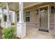 Charming front porch with brick facade and decorative columns, offering a welcoming entrance at 2239 Chestnut Pass, Decatur, GA 30033