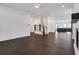 Spacious open-concept living room featuring hardwood floors, white walls, and lots of natural light at 2239 Chestnut Pass, Decatur, GA 30033
