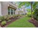 Well-maintained side yard with green grass, mulch, and privacy landscaping at 2239 Chestnut Pass, Decatur, GA 30033