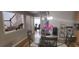 Cozy dining area featuring a glass table, decorative chairs, and hardwood floors at 3416 Haddon Hall Ct, Buford, GA 30519