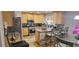 Stylish kitchen with stainless appliances, a center island with bar seating, and hardwood flooring at 3416 Haddon Hall Ct, Buford, GA 30519