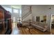 Spacious living room with high ceilings, hardwood floors, and plenty of natural light at 3416 Haddon Hall Ct, Buford, GA 30519