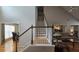 View of staircase and living areas including the dining room and kitchen at 3416 Haddon Hall Ct, Buford, GA 30519