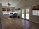 Bright sun room with tile floors, vaulted ceiling, and lots of natural light at 3416 Haddon Hall Ct, Buford, GA 30519