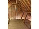 Spacious attic features unfinished flooring and roof trusses at 828 Cedar Stream Ct, Loganville, GA 30052