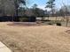 Well-maintained backyard featuring a neatly kept lawn, landscaping and a charming fence at 828 Cedar Stream Ct, Loganville, GA 30052