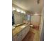 Bathroom features a granite countertop, ample cabinets, and a tub/shower combo at 828 Cedar Stream Ct, Loganville, GA 30052