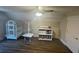 Bonus room with hardwood floors, ceiling fan, and one large bird cage at 828 Cedar Stream Ct, Loganville, GA 30052