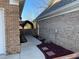 Home exterior featuring a walkway, brick facade and manicured landscaping at 828 Cedar Stream Ct, Loganville, GA 30052
