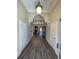 Elegant foyer featuring hardwood floors, high ceilings, and an open view to the living area at 828 Cedar Stream Ct, Loganville, GA 30052