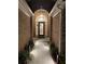Inviting front entrance featuring a glass detailed front door and landscape lighting at 828 Cedar Stream Ct, Loganville, GA 30052