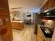 Functional kitchen layout with island, stainless appliances, stone backsplash, and wood cabinets at 828 Cedar Stream Ct, Loganville, GA 30052