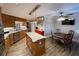 Bright kitchen features an island with granite countertops, stainless steel appliances, and a cozy breakfast nook at 828 Cedar Stream Ct, Loganville, GA 30052